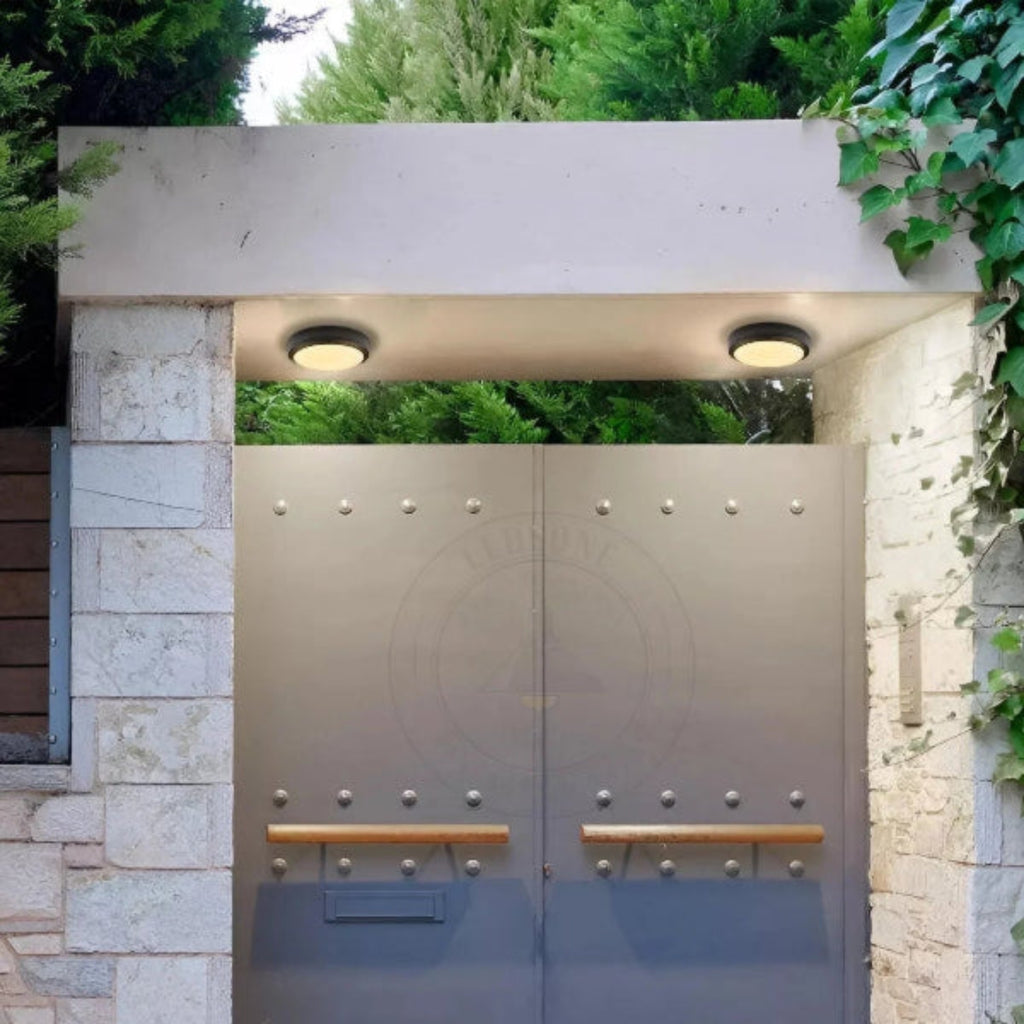 Modern double door entrance with stone walls and greenery